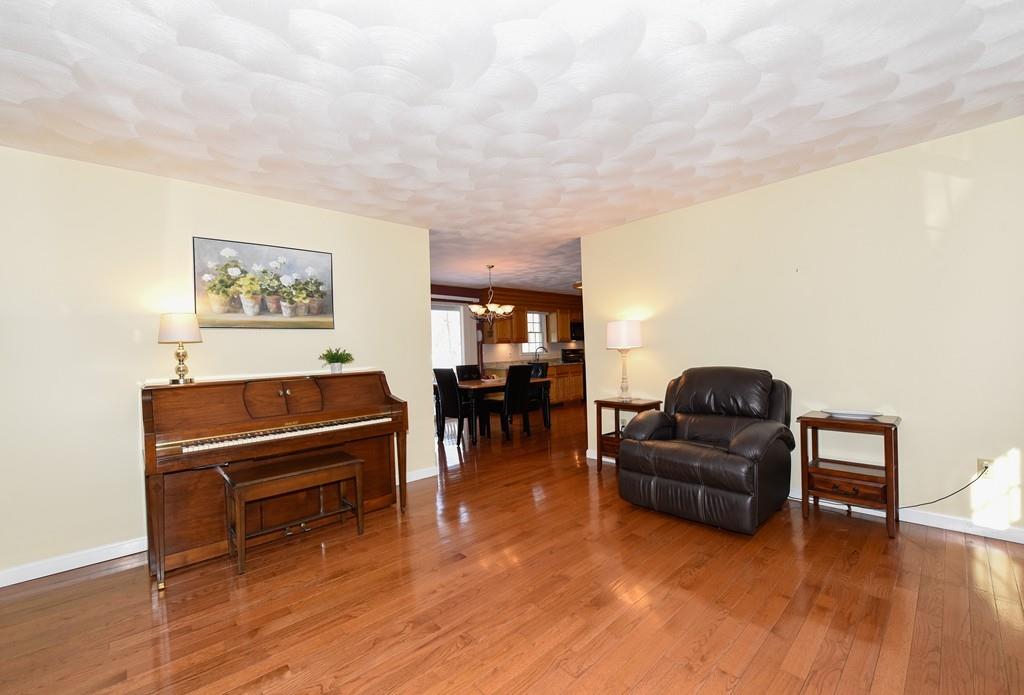 624 Boston Road Groton, MA 01450 - Photo 12 of 25 a living room with furniture and a piano