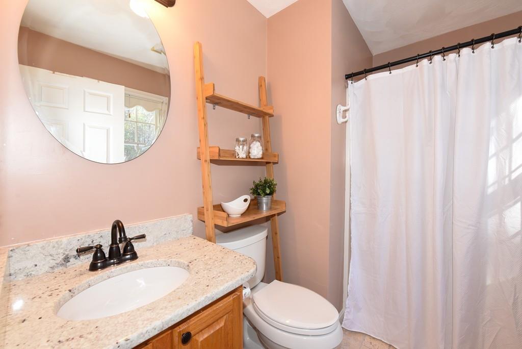 624 Boston Road Groton, MA 01450 - Photo 15 of 25 a bathroom with a sink vanity mirror and toilet