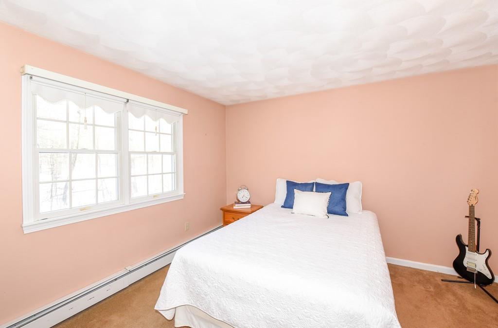 624 Boston Road Groton, MA 01450 - Photo 16 of 25 a bedroom with a bed and a window
