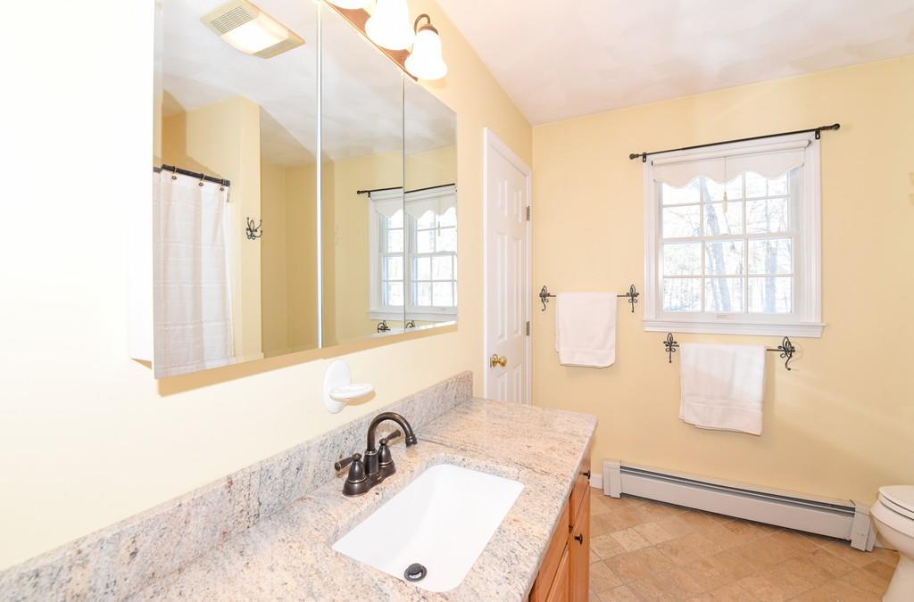 624 Boston Road Groton, MA 01450 - Photo 18 of 25 a bathroom with a sink and a mirror