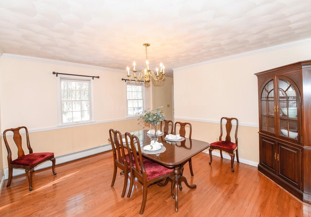 624 Boston Road Groton, MA 01450 - Photo 10 of 25 a view of a dining room with furniture window and wooden floor