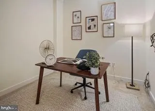 a living room with furniture and a rug