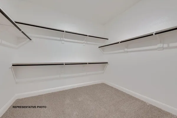 a view of an empty walk in closet