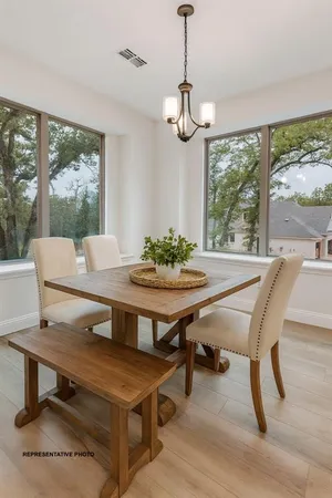 a view of a dining room with furniture window and outside view