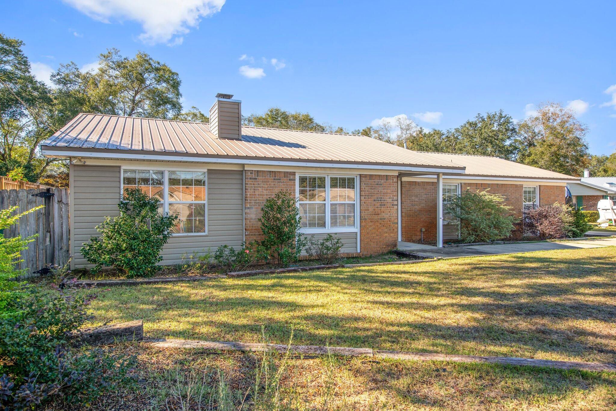 226 Terri Cove Niceville, FL 32578 - Photo 1 of 42 a view of a house with a swimming pool