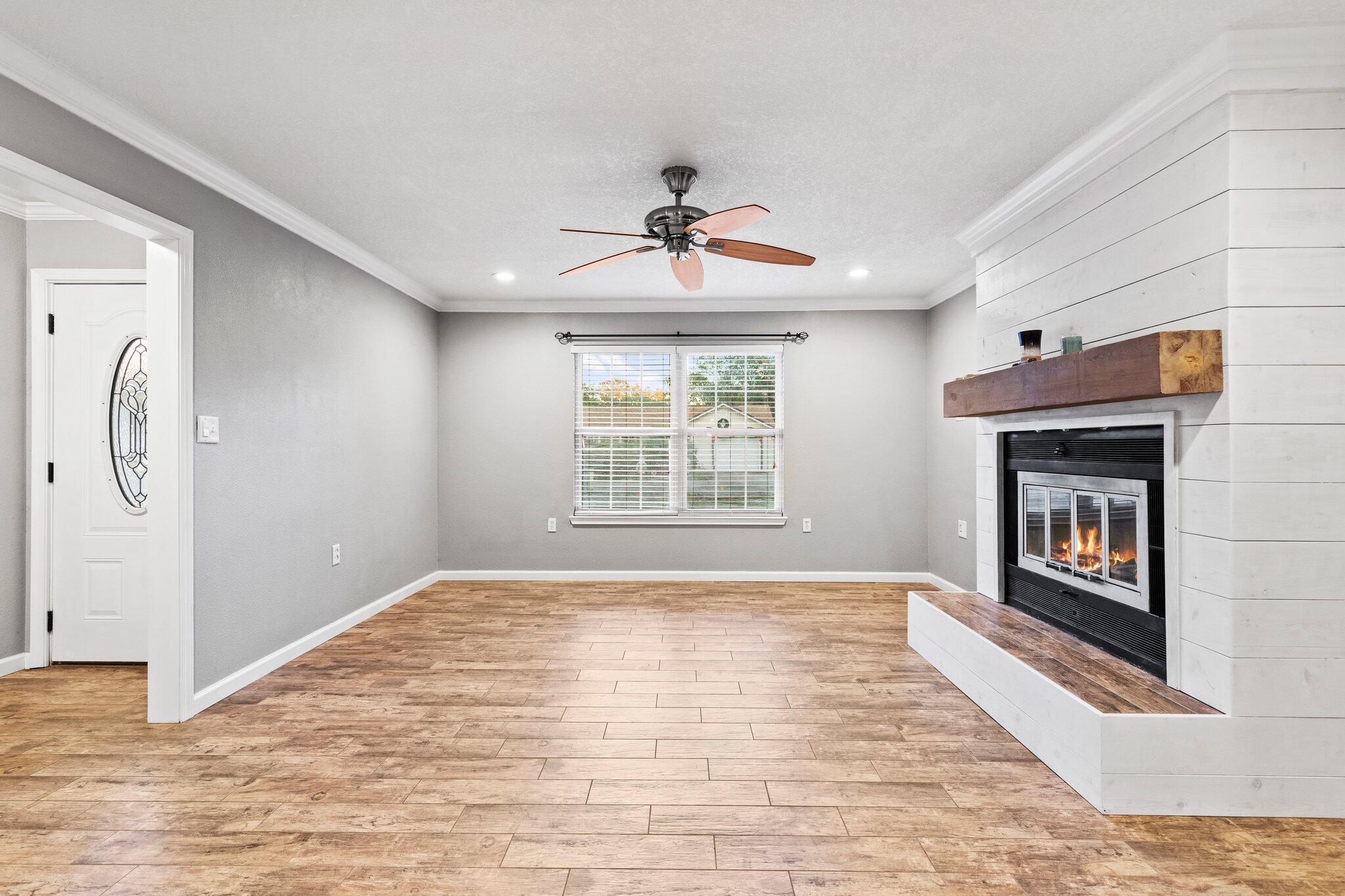 226 Terri Cove Niceville, FL 32578 - Photo 13 of 42 a view of an empty room with window and fire place