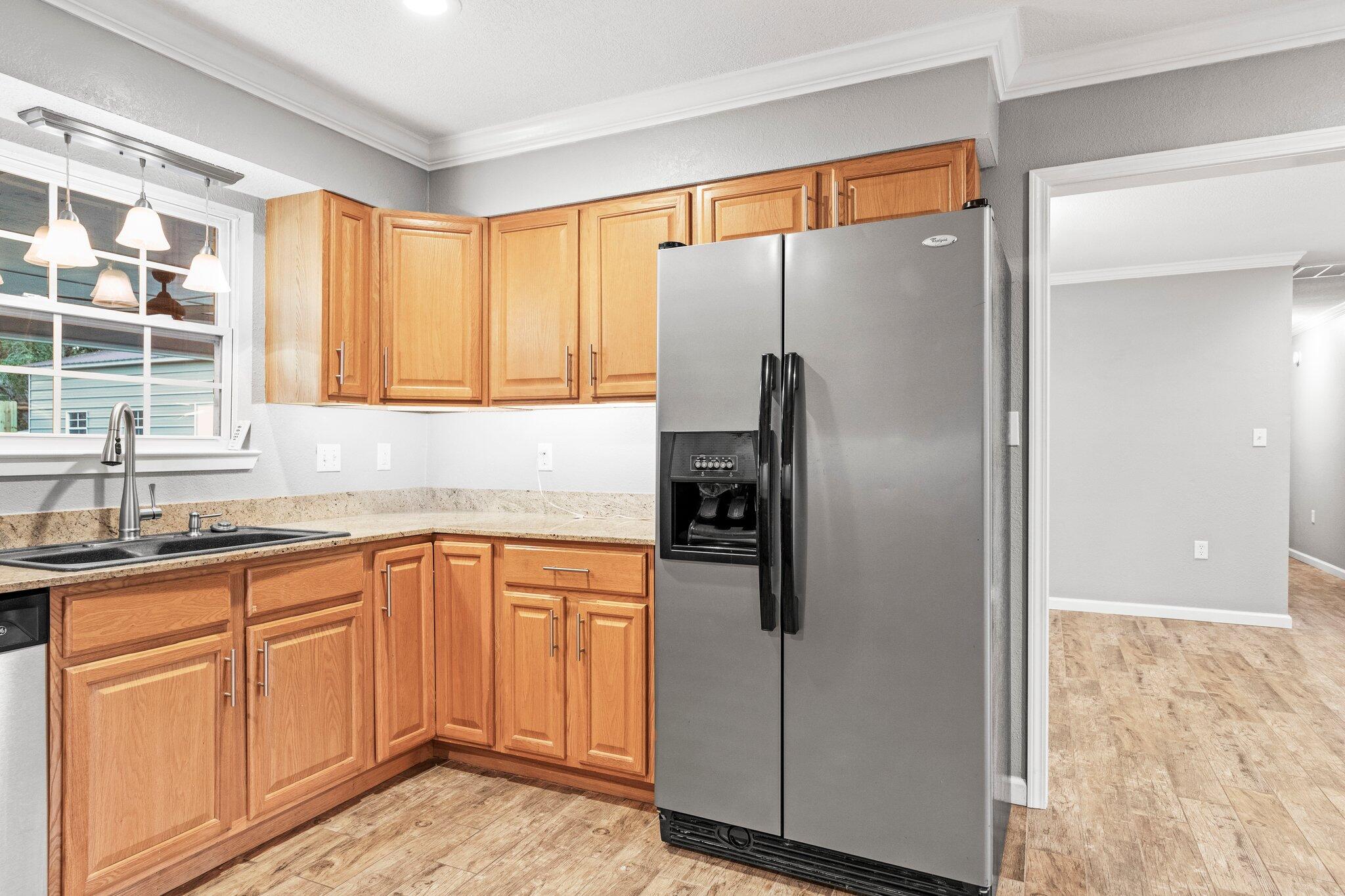 226 Terri Cove Niceville, FL 32578 - Photo 15 of 42 a kitchen with stainless steel appliances granite countertop a refrigerator and a sink