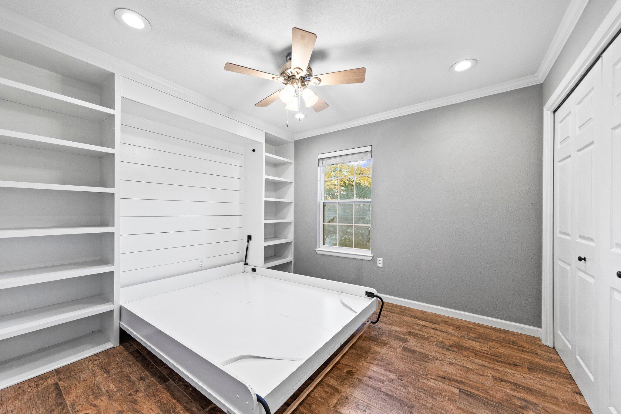 226 Terri Cove Niceville, FL 32578 - Photo 21 of 42 a workspace with a bed and a window