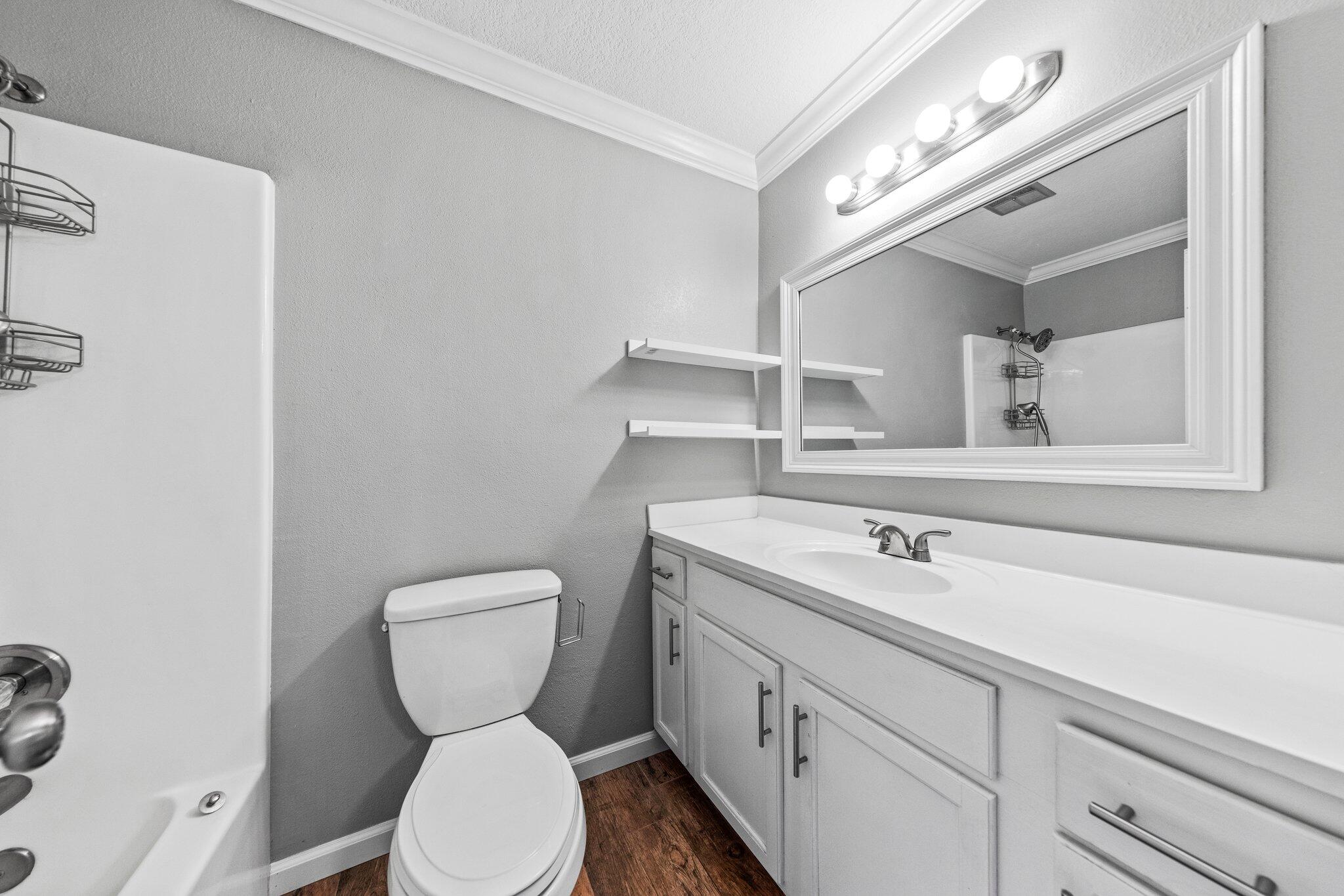 226 Terri Cove Niceville, FL 32578 - Photo 28 of 42 a bathroom with a toilet sink and mirror