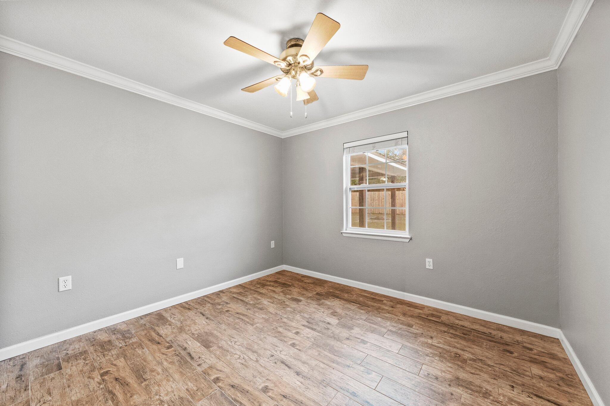 226 Terri Cove Niceville, FL 32578 - Photo 29 of 42 wooden floor in an empty room with a window