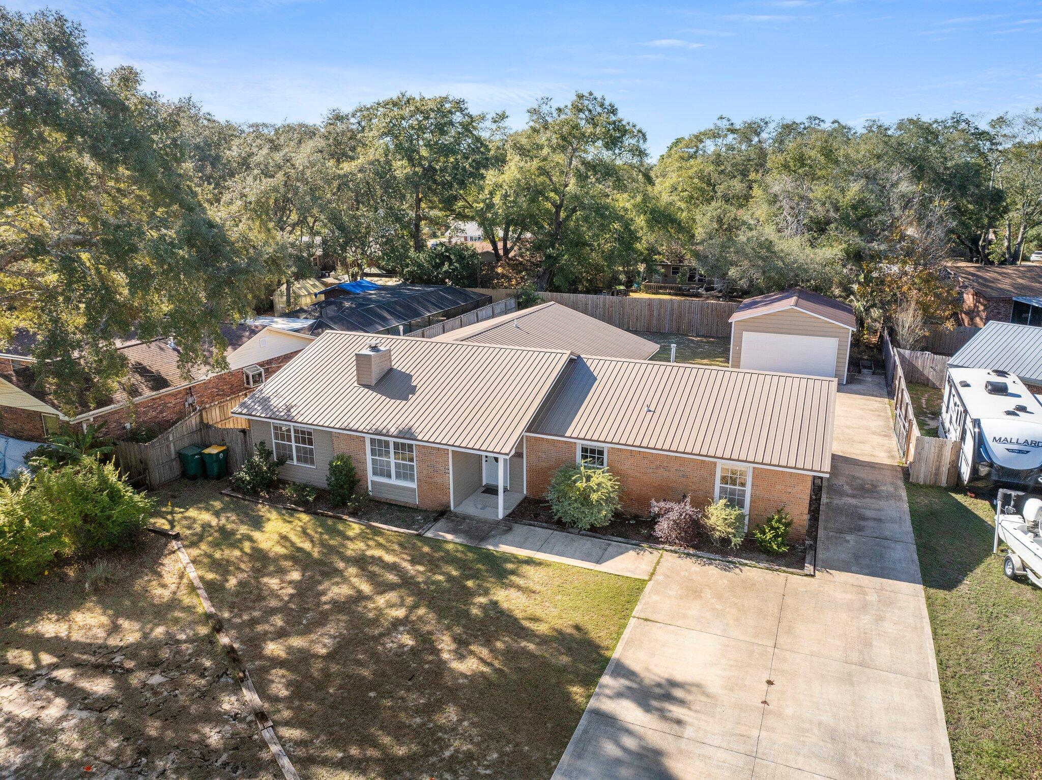 226 Terri Cove Niceville, FL 32578 - Photo 3 of 42 an aerial view of a house with a yard and sitting area