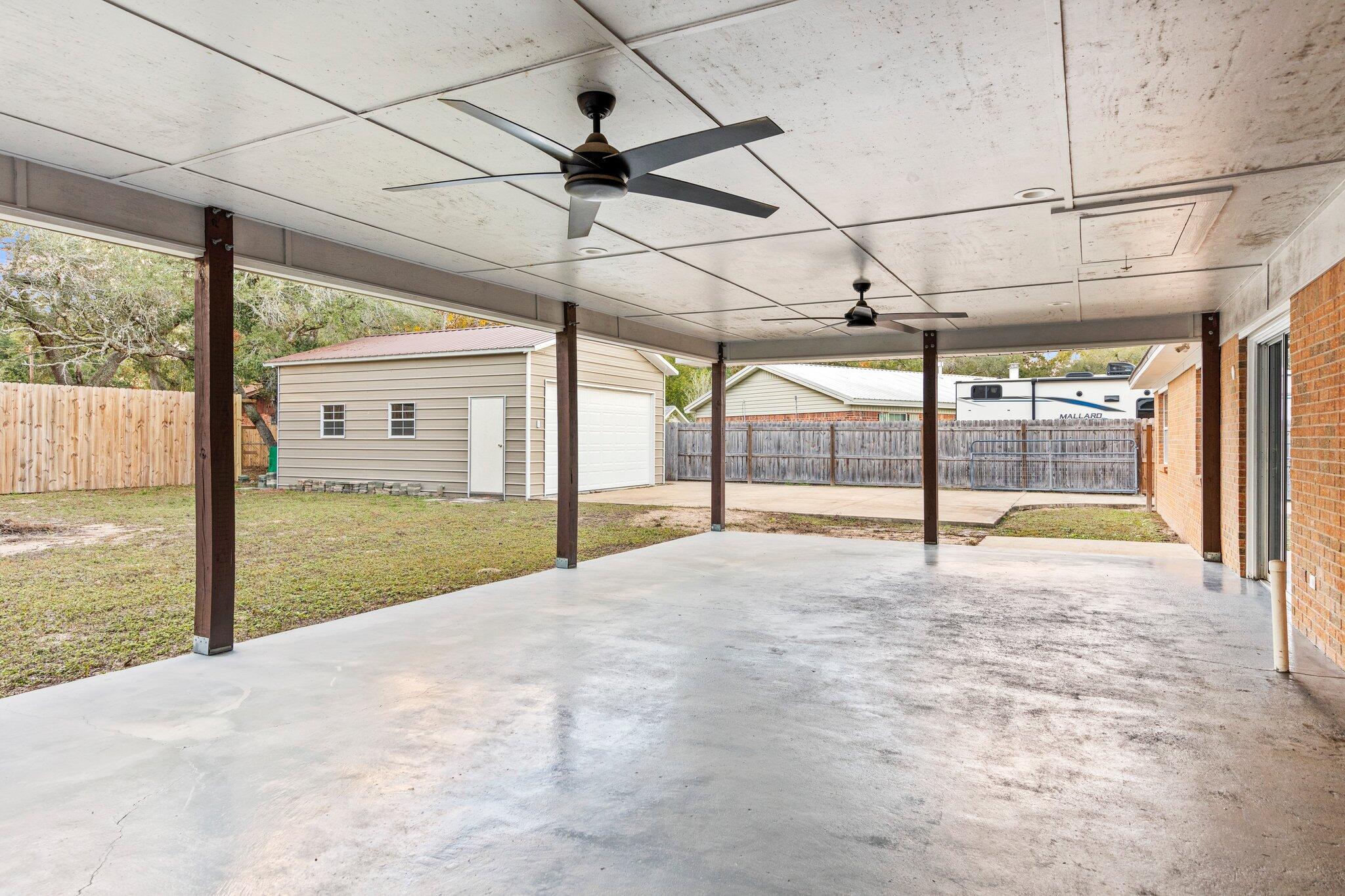 226 Terri Cove Niceville, FL 32578 - Photo 34 of 42 a view of an empty room with a floor to ceiling window and a yard