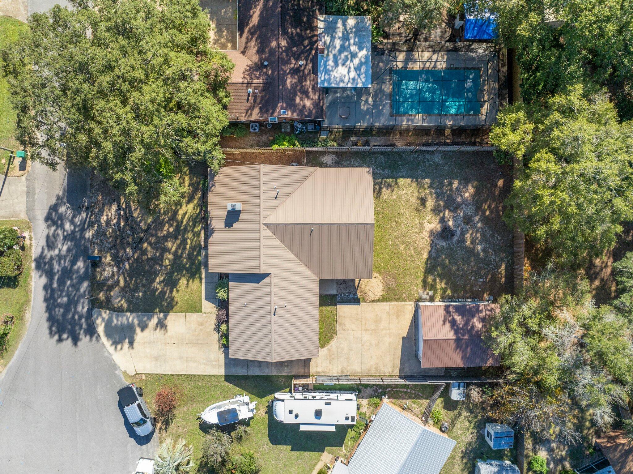 226 Terri Cove Niceville, FL 32578 - Photo 40 of 42 an aerial view of a house with swimming pool and outdoor seating
