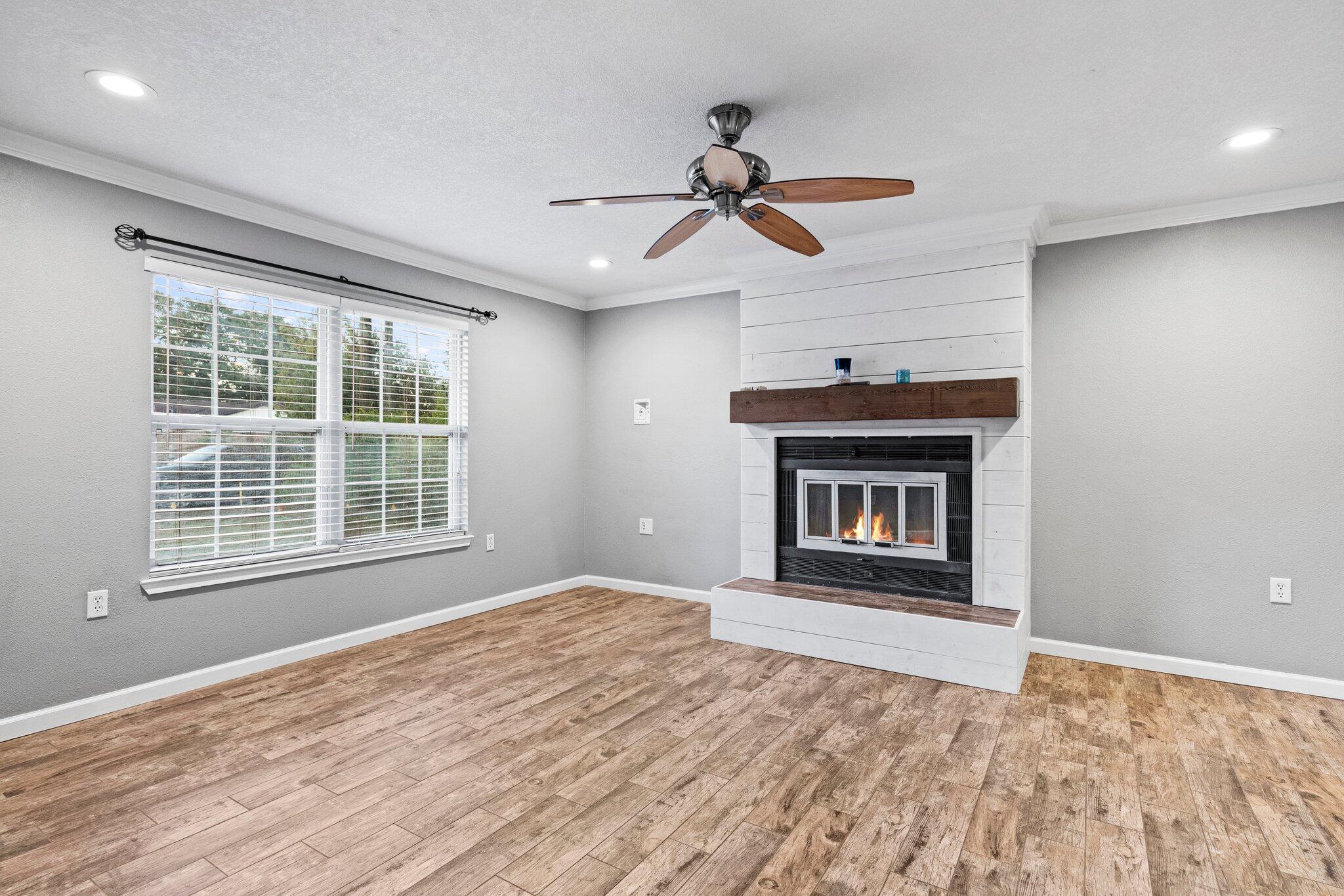 226 Terri Cove Niceville, FL 32578 - Photo 9 of 42 a view of an empty room with a window and fireplace