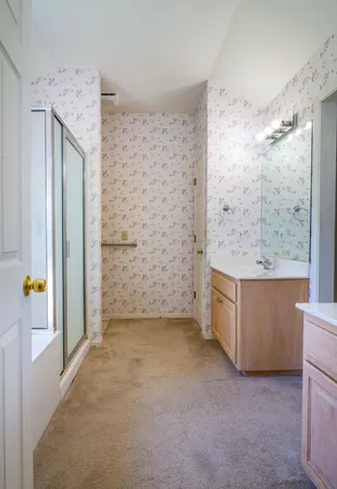 a bathroom with a sink double vanity and a mirror