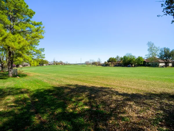 a view of a yard with an outdoor space