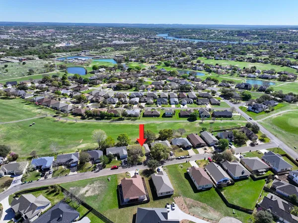 an aerial view of a houses with a outdoor space