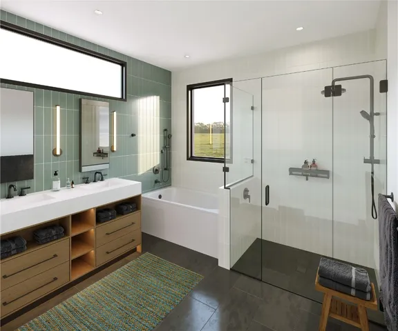 a bathroom with a double vanity sink toilet mirror and bathtub