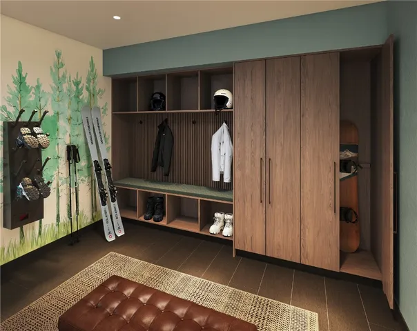 a view of an entryway with wooden floor