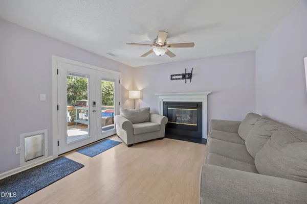 a view of a dining room with furniture and a window
