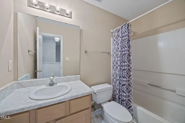 a view of a livingroom with workspace and a window