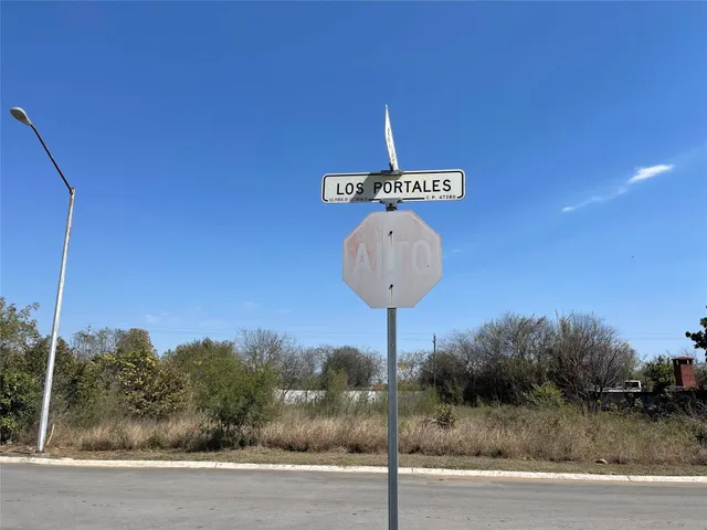 a front view of a house with wooden fence