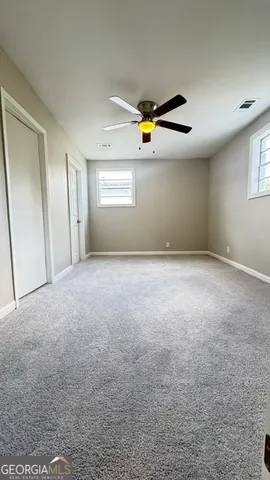 a bathroom with a toilet a sink and shower