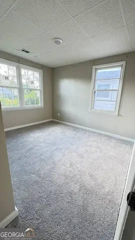 an empty room with windows