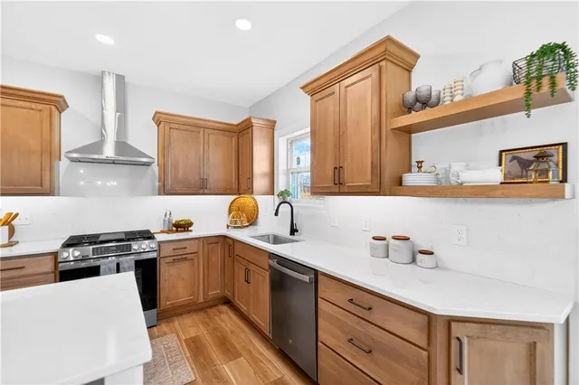 a kitchen with a sink a stove and cabinets