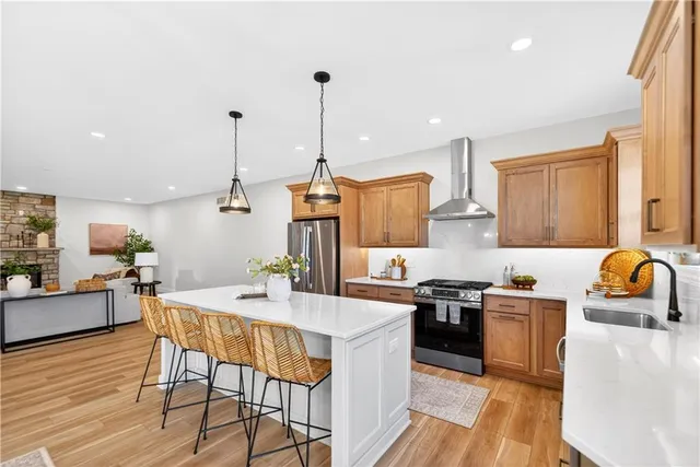a kitchen with a table chairs stove and microwave