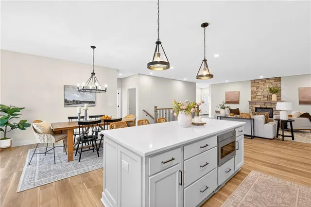 a view of living room kitchen island stainless steel appliances and living room view