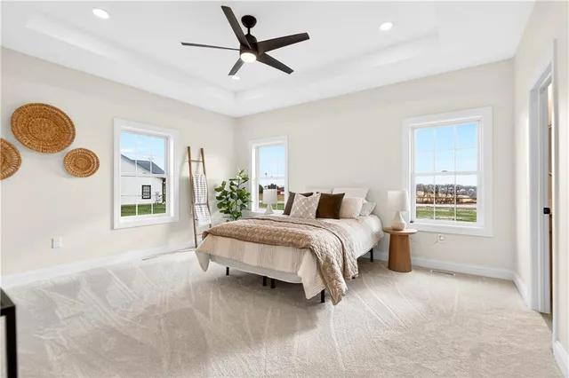 a spacious bedroom with a large bed and a window