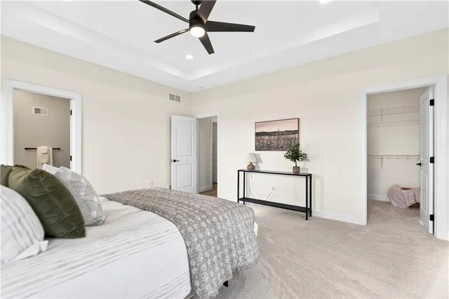 a bedroom with a bed and a cabinets