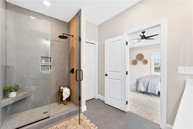 a bathroom with a bathtub and a shower