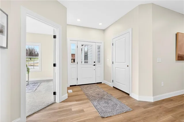 wooden floor with white walls