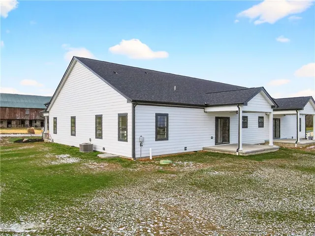a view of a house with a big yard