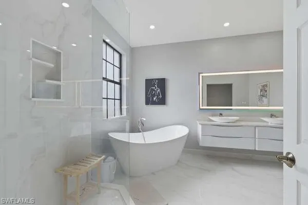 a bathroom with a white tub sink