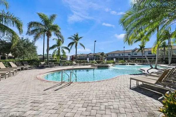 a view of swimming pool with chairs