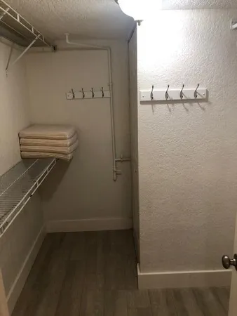 a view of a livingroom with an empty space and window