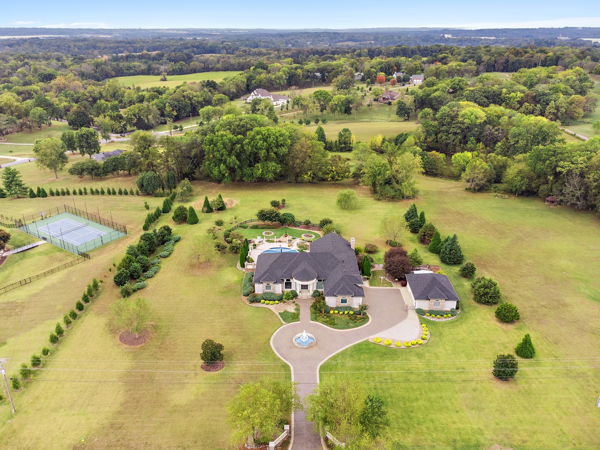 1598 Palmer Road Lebanon, TN 37090 - Photo 13 of 56 a view of a swimming pool with a lot of trees in the background
