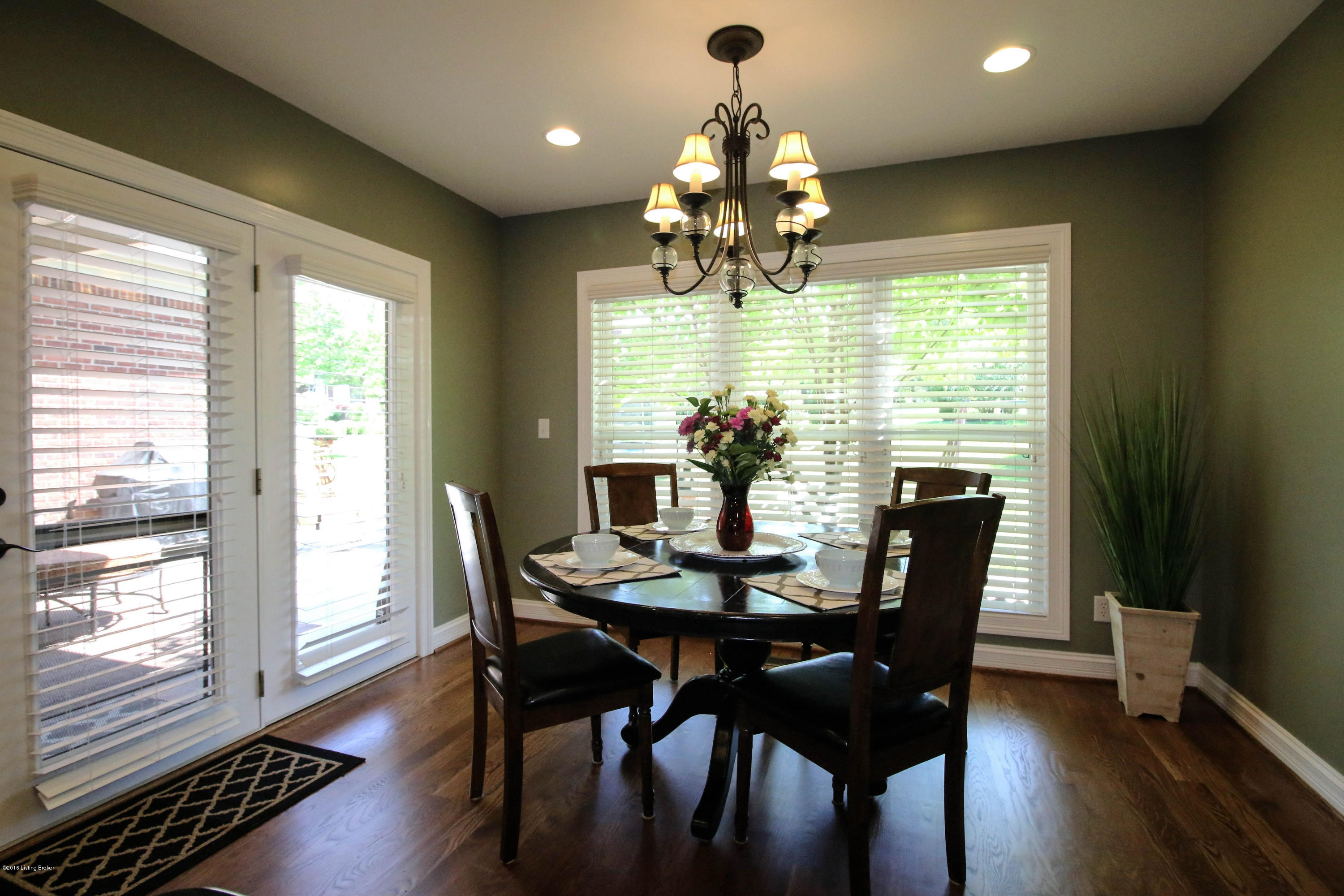 2904 Doe Ridge Court Prospect, KY 40059 - Photo 13 of 86 The eat-in dining area is bathed in natural light from two sides and finished with a gorgeous chandelier. Access the comfortable patio from this space.