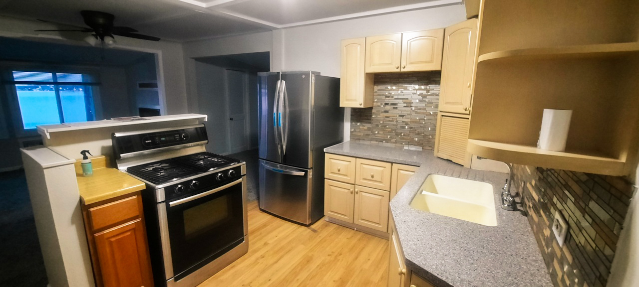 185 Eagle Point Road Fox Lake, IL 60020 - Photo 19 of 42 a kitchen with stainless steel appliances granite countertop a refrigerator a stove and a sink
