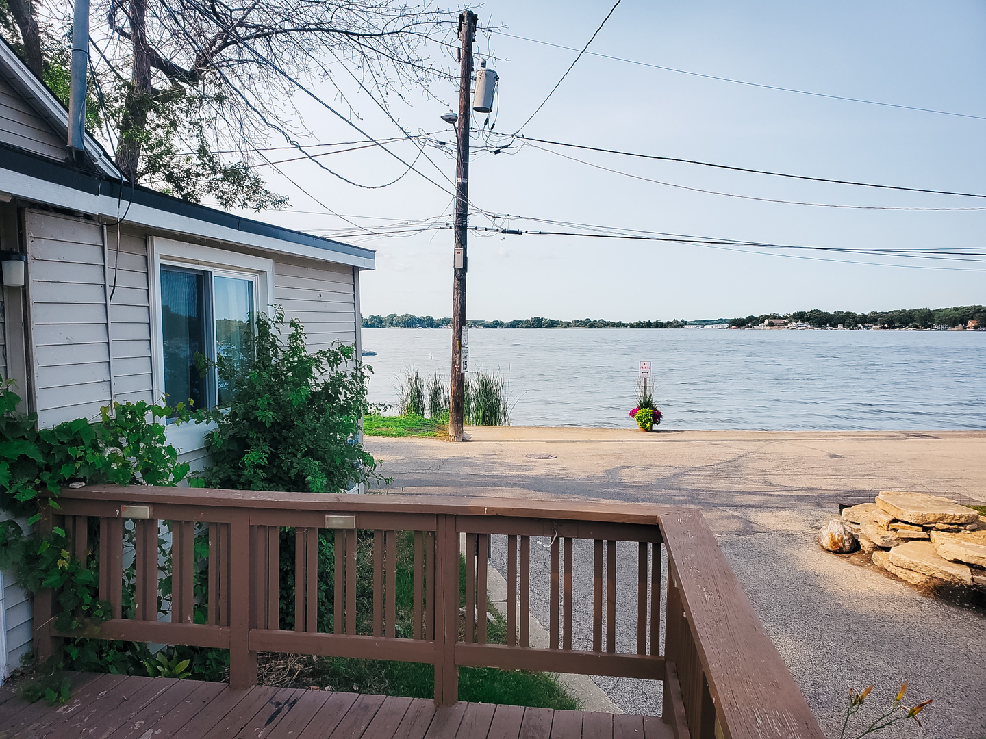 185 Eagle Point Road Fox Lake, IL 60020 - Photo 8 of 42 a view of a balcony with wooden chairs