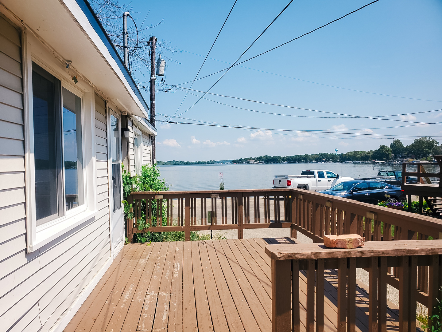 185 Eagle Point Road Fox Lake, IL 60020 - Photo 9 of 42 a view of balcony with wooden floor and outdoor seating