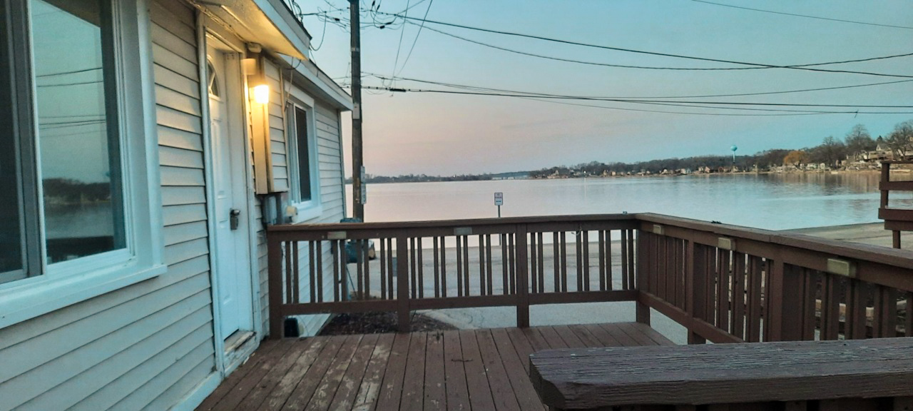 185 Eagle Point Road Fox Lake, IL 60020 - Photo 10 of 42 a view of balcony with wooden floor and outdoor seating