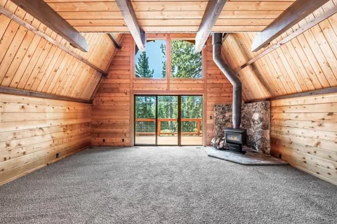 a view of an empty room with windows