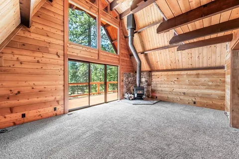a view of a room with an empty space and a balcony