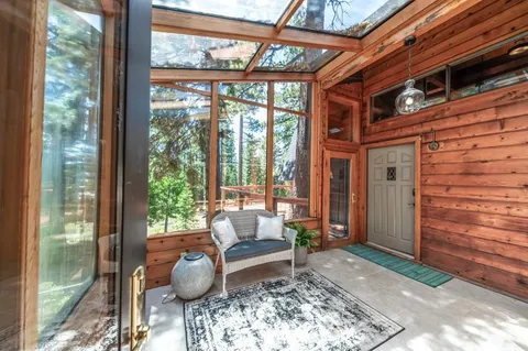 a living room with furniture and a outdoor space