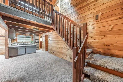 a view of a hallway with stairs