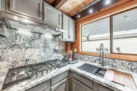 a kitchen with a sink and a stove